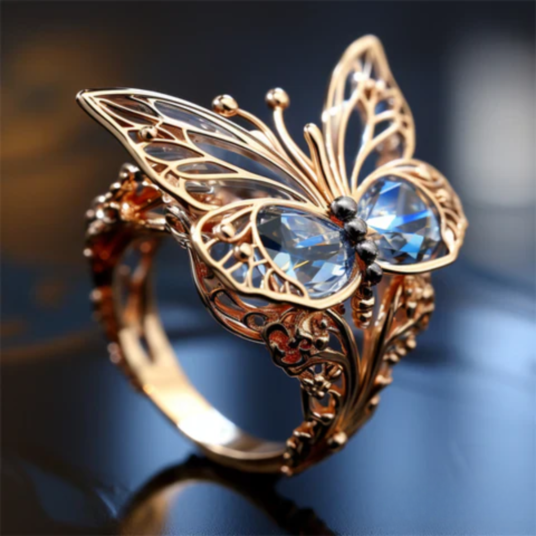 ANEL DE BORBOLETA DOURADA COM CRISTAL AZUL